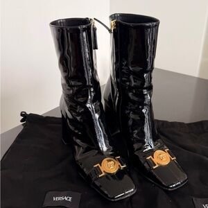 Versace Glossy Black Ankle Booties with Gold Accents